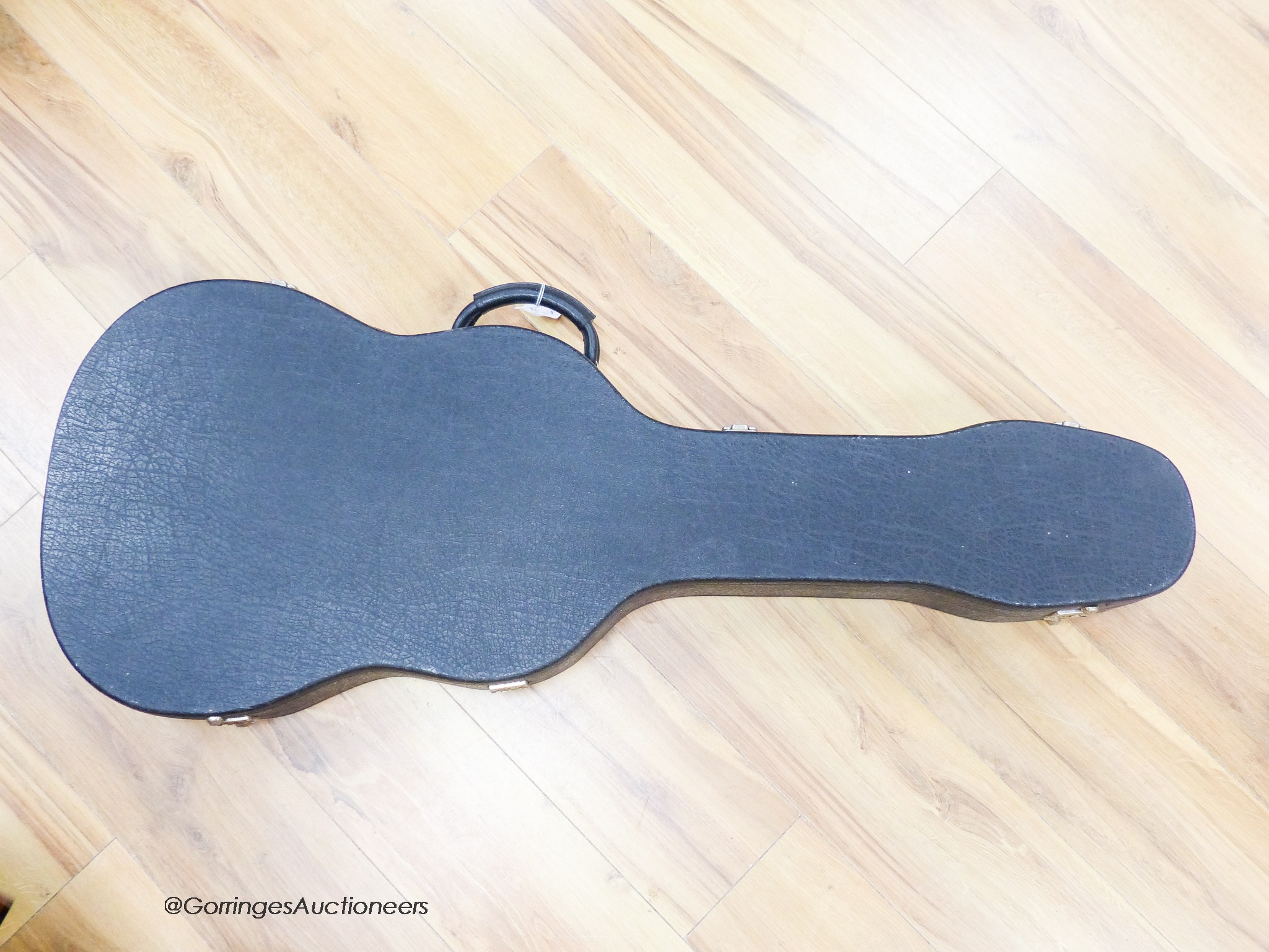 An Encore electric guitar with hard case